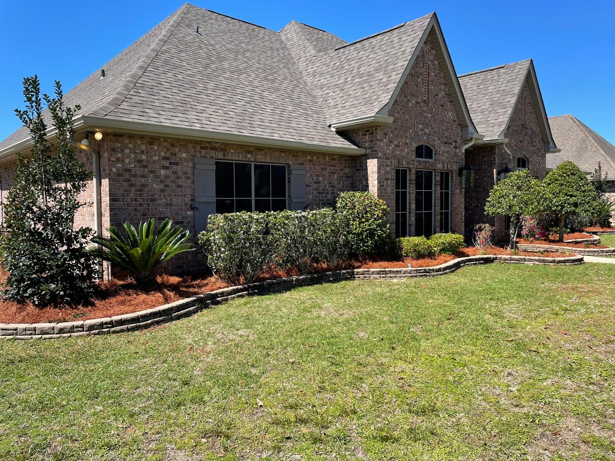 Landscaping with curved mulch beds and stone edging on the Northshore