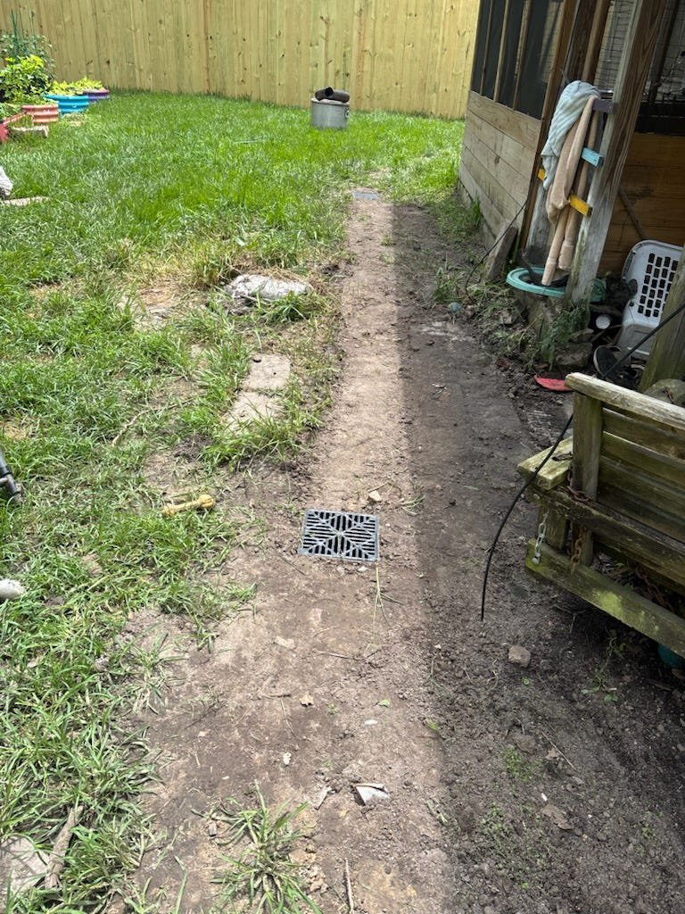Soggy side yard before a drainage fix